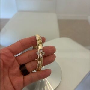Elegant Gold and Silver Bracelet with Floral Accent 129 each